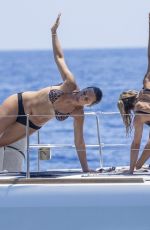 MICHELLE HUNZIKER in Bikini Doing Yoga at a Boat at Aeolian Islands 07/15/2026