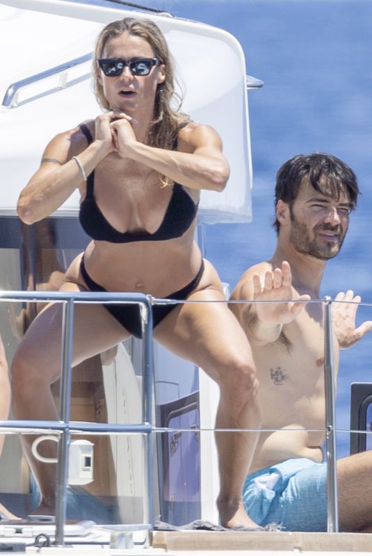 MICHELLE HUNZIKER in Bikini Doing Yoga at a Boat at Aeolian Islands 07/15/2026